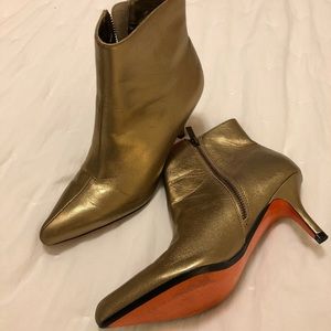 Leather gold booties with orange sole